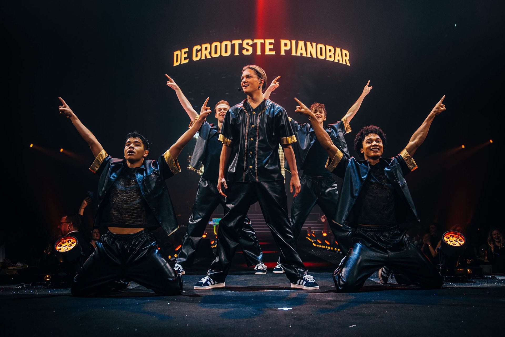 Luuk van der Boom on stage with dancers at The Pianoman Live 2025. Custom made outfits by Passionfruit + Lemonade